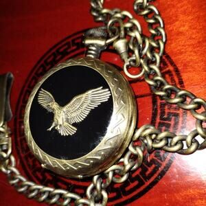 In pristine condition is this Benrus gold and Black eagle pocket watch